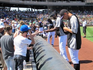 Rockies players signing autographs