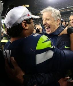 Russell Wilson and Pete Carroll celebrating NFC Championship