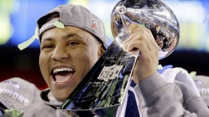 Seattle Linebacker Malcom Smith hoists the Lombardi Trophy