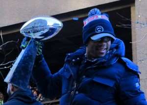 Russell Wilson hoists the Lombardi Trophy at Seahawks Victory Celebration in downtown Seattle...photo by Mark Arnold