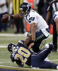 Russell Wilson goes down on one of six sacks on the day