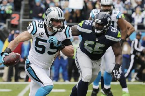 Carolina linebacker Luke Kuechly returning his interception of a Russell Wilson pass for a TD