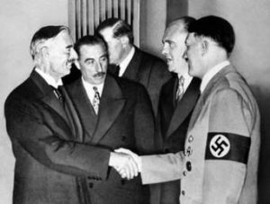 Neville Chamberlain (left) shaking Hiltler's hand at Munich, 1938
